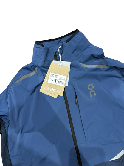 Blue jacket with a tag on a white background